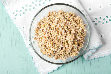 
Green sprouted buckwheat in a glass bowl. Flat top view copy space. Healthy vegan food, eco food,...