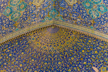 Interior view of the lofty dome covered with polychrome tiles of the Shah Mosque, which is situated...