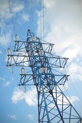 Electricity transmission pylon view against the sky. High voltage line.