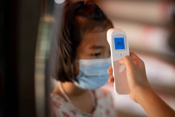 Covid-19 safety and social distaincing concept, kids checking body temperature protect coronavirus...