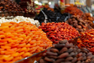 Dried fruits on the market counter. Healthy foods. Close-up. Selective focus.