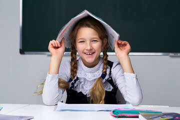 Fototapeta na wymiar Portrait of cute schoolgirl.Back to school, education concept.