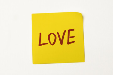 blank sticker on the fridge with a heart magnet
