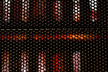 Abstract grid in front of the cooler of a gaming computer close up macro shot.
