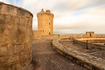 Tower of Bellver castle with clouds in motion in the sky in Mallorca, Spain