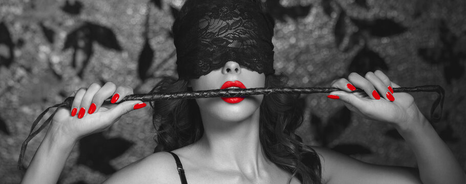 Sexy woman in blindfold bite whip black and white selective colored banner