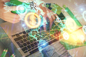 Double exposure of woman hands typing on computer and forex chart hologram drawing. Stock market...