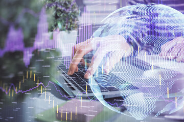 Double exposure of woman hands typing on computer and forex chart hologram drawing. Stock market invest concept.