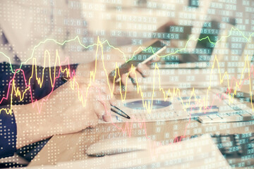 Double exposure of man's hands holding and using a digital device and forex graph drawing. Financial market concept.