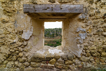 Old stone door and window of medieval architecture. Stone background.

