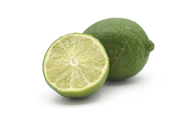 Closeup of fresh green lemon on white background