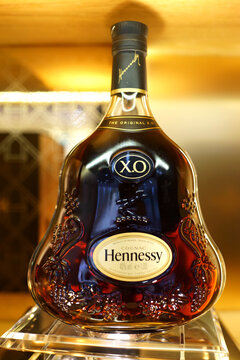 Hennessy cognac on duty-free store shelf in Changi Airport. Jas Hennessy & Co. sells about 50 million bottles a year worldwide. It is the world's largest cognac produce. SINGAPORE - APR 22, 2018.