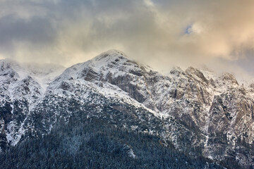 Naklejka na ściany i meble Winter landscape with rocky mountains