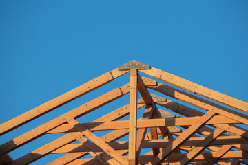Close-up of the roof Gables on a stick built house under construction and blue sky. New roof design...