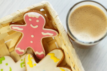 Gingerbread with coffee, ginger sweet homemade cookies in a basket with cup of hot drink, breakfast surprise for birthday Valentine's day