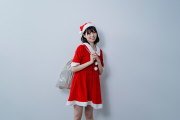 Obraz premium サンタクロースのコスプレをした女性