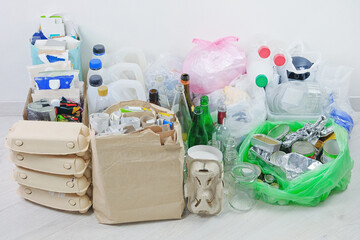 Recyclable garbage: glass, different plastic, paper, cardboard, metal prepared for recycling. Waste...