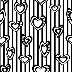Seamless vector pattern. Stylized black and white hearts on a striped background.
