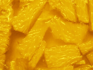 Flatlay. Pieces of juicy oranges in a transparent fragrant edible gel. Minimalism in food. Trendy pantone colors of 2021- Illuminating Yellow. Toned creative food background. Copy space.