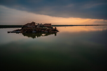 Sunset, reflection and ruins