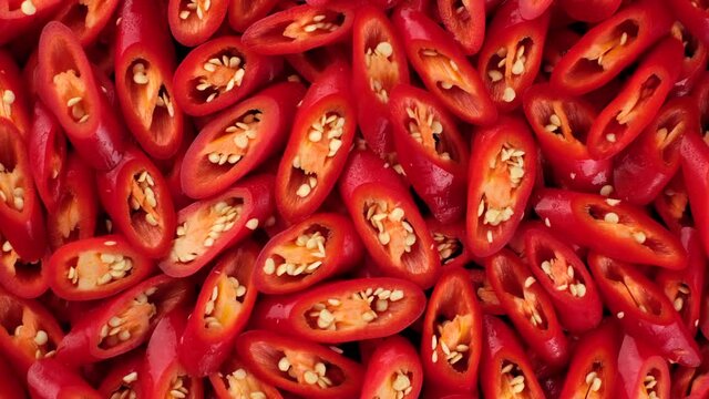 chopped red hod chili pepper. top view rotation