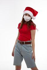 girl wearing a Santa hat red t-shirt medical mask protection new year