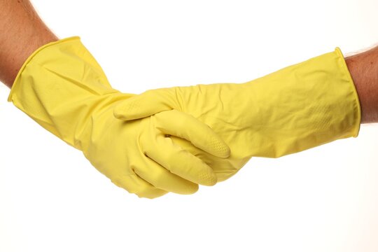 Clener hands in yellow mittens on a white background