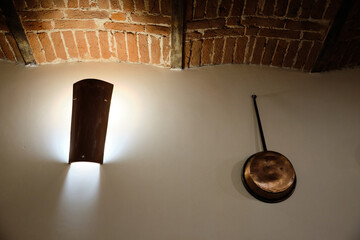 particular of a spotlight and copper pot in a renovated vintage tavern