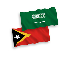 Naklejka premium National vector fabric wave flags of Saudi Arabia and East Timor isolated on white background. 1 to 2 proportion.