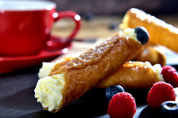 Homemade cannoli with whipping cream