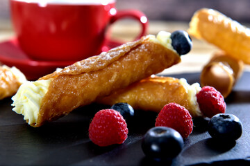 Homemade cannoli with whipping cream