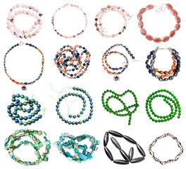 collection of various strings of beads from gemstones (rose quartz, nephrite, jade, nacre, river...