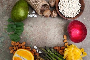 Frame made of Foods high in vitamin B9. Healthy foods, sources of folic acid. Top view with copy space. Diet is necessary for pregnant and lactating mothers. Vegetarian food set.Place for text.