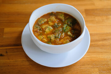 Sour curry soup with vegetable omelet