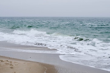 Stormy sea. Waves roll onto the shore. Beach.