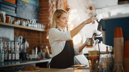 Beautiful Young Caucasian Barista with Blond Hair is Making a Cup of Fresh Coffee in a Cafe. Happy...