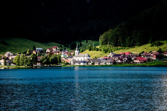 Village by lake in dark