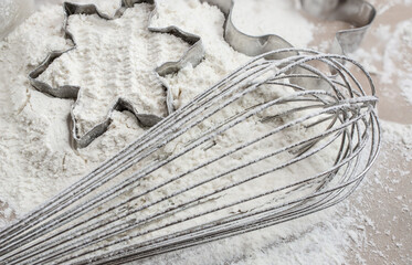 The process of baking cookies at home, closeup on cookie cutter on dough and rolling pin