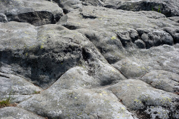 Texture of mountain rocks polished by winds and rains. Abstract background