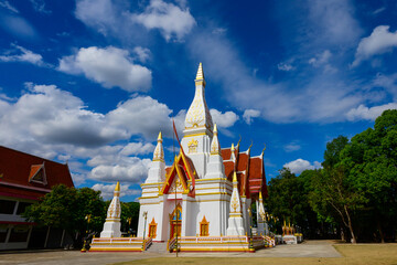 Beautiful White buddhist pagoda on blue sky with white clouds,Wat Nong Khrok,Sisaket...