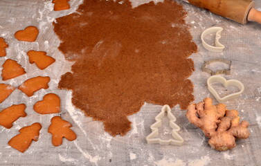 Flat rolled Raw gingerbread dough for cooking Christmas cookies, top view, Gingerbread dough background. Prepare Christmas gingerbread cookies