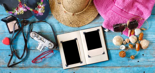Gardinen enjoying photography during summer holidays, camera, photo album with empty frames and vacation items,flat lay © Kirsten Hinte