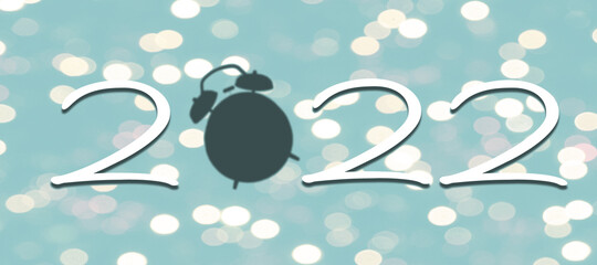 forming 2022 new year's with alarm silhouette and bokeh lights background