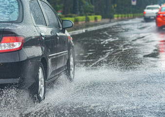 Car driving through flood in Thailand.

