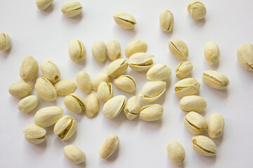 Pile of Pistachios isolated on white background. Pistachios closeup for your design and print. Nuts collection