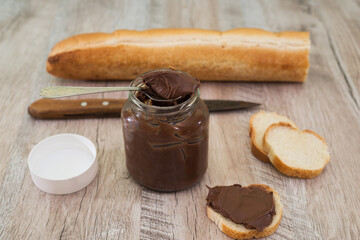 jar of chocolate nut spread and baguette slices