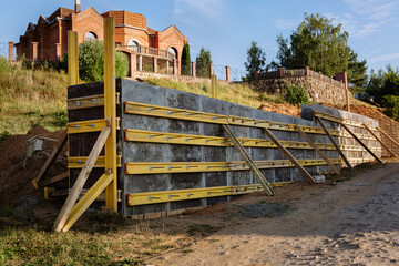 The construction of a retaining wall or counterfort, formwork, reinforced, preparation to pour...