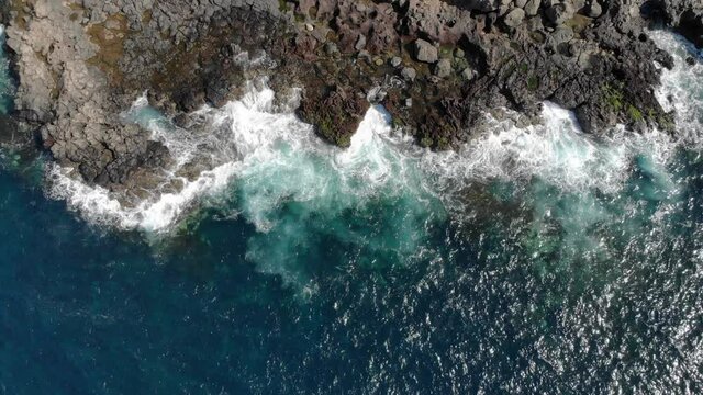 Aerial view of rocks, waves and blue ocean. Lanzarote, Canary Islands.