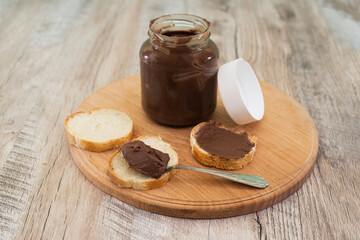 jar of chocolate nut spread and baguette slices