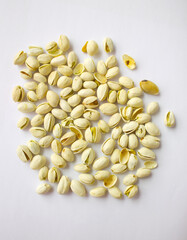 Pistachios isolated on white background, top view. 